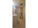 Functional bathroom features a shower stall, toilet, and sink with built in cabinets at 1409 S Clermont St, Denver, CO 80222