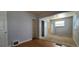 Cozy bedroom with blended flooring, closet, and bright natural light at 1409 S Clermont St, Denver, CO 80222