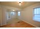 Bright bedroom with natural light, blended floors, and closet space at 1409 S Clermont St, Denver, CO 80222