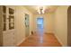 Bright dining area featuring hardwood floors, a built in, and a view into other rooms at 1409 S Clermont St, Denver, CO 80222