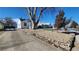 Charming home with drought tolerant rock yard and mature tree at 1409 S Clermont St, Denver, CO 80222