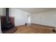 Spacious living room features hardwood floors and a striking red brick fireplace at 1409 S Clermont St, Denver, CO 80222