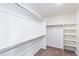 Walk-in closet with carpet, shelving, and metal hanging rods for ample storage at 21761 E 7Th Ave, Aurora, CO 80018