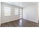 Bright entryway with wood floors, white walls, and modern front door with natural light at 21761 E 7Th Ave, Aurora, CO 80018