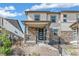 Charming townhouse featuring stone accents, a covered porch, and inviting curb appeal at 21761 E 7Th Ave, Aurora, CO 80018