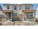 Attractive townhouse showcases a striking stone facade and a welcoming entrance with a small front yard at 21761 E 7Th Ave, Aurora, CO 80018