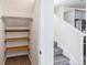 Hallway with carpeted stairs, closet, and view of the kitchen at 21761 E 7Th Ave, Aurora, CO 80018