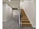 Carpeted basement with bar and stairs at 3711 Pecos St, Denver, CO 80211
