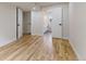 Spacious bedroom with hardwood floors, modern doors, and access to a bathroom at 3711 Pecos St, Denver, CO 80211