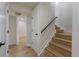 Bright hallway with hardwood floors, a staircase, and access to other rooms at 3711 Pecos St, Denver, CO 80211