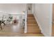 Open-concept living area with hardwood floors, a staircase, and a view of the living room at 3711 Pecos St, Denver, CO 80211