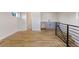 Open living room featuring wood floors, a wet bar, and plenty of natural light at 3711 Pecos St, Denver, CO 80211