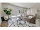 Cozy living room with a comfortable couch, stylish rug, and access to the outdoors at 3711 Pecos St, Denver, CO 80211