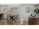 Bright living space featuring a dining table, modern art, and contemporary seating at 3711 Pecos St, Denver, CO 80211
