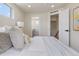 Comfortable main bedroom with a bright, modern aesthetic and ensuite bathroom at 3711 Pecos St, Denver, CO 80211