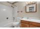 The bathroom offers a shower-tub combo, neutral tile, and a single sink vanity at 2485 S Xanadu Way # D, Aurora, CO 80014