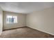 Bright, carpeted bedroom with natural light from a large window at 2485 S Xanadu Way # D, Aurora, CO 80014