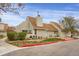 Charming home featuring a well-maintained yard with mature trees and manicured landscaping at 2485 S Xanadu Way # D, Aurora, CO 80014