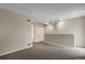 The spacious living room features neutral walls, carpet, and ample natural light at 2485 S Xanadu Way # D, Aurora, CO 80014