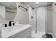 Modern bathroom with a walk-in shower and updated fixtures at 6148 Nelson St, Arvada, CO 80004