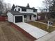 Newly renovated home with modern exterior and large driveway at 6148 Nelson St, Arvada, CO 80004