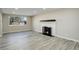 Living room with a fireplace and hardwood floors at 6148 Nelson St, Arvada, CO 80004