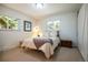 Cozy bedroom with two windows and neutral colors at 10395 W 74Th Pl, Arvada, CO 80005