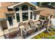 Relaxing outdoor living space featuring modern furniture, potted plants, and a stylish railing at 10395 W 74Th Pl, Arvada, CO 80005