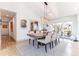 Bright dining area with hardwood floors, neutral tones, and easy access to the outdoor space at 10395 W 74Th Pl, Arvada, CO 80005
