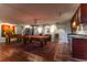 Spacious game room with pool table, wet bar, and ample space for entertaining at 10395 W 74Th Pl, Arvada, CO 80005