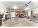 Large garage includes a utility sink, cabinets, and ample storage space for tools and supplies at 10395 W 74Th Pl, Arvada, CO 80005