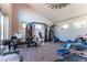Spacious gym with ample room for exercise equipment and natural light at 10395 W 74Th Pl, Arvada, CO 80005