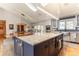 Spacious open kitchen with a large island, seating, and modern appliances at 10395 W 74Th Pl, Arvada, CO 80005