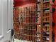 Well-stocked wine cellar with custom-built racking for extensive bottle storage at 10395 W 74Th Pl, Arvada, CO 80005
