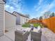 Backyard patio area with lounge seating and a view of the lawn and landscaping at 4787 S Grant St, Englewood, CO 80113