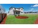 Spacious backyard featuring a large grassy area, privacy fence, and patio at 13446 Amber Sky St, Parker, CO 80134