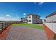 Spacious backyard with a well-maintained lawn and wood fence, ideal for outdoor activities and relaxation at 13446 Amber Sky St, Parker, CO 80134