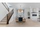Elegant dining room with modern light fixture and access to the living area at 13446 Amber Sky St, Parker, CO 80134