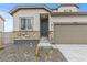 Traditional home exterior with stone accents and neutral siding at 13446 Amber Sky St, Parker, CO 80134