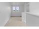 Bright hallway on a second floor with large windows and neutral carpet at 13446 Amber Sky St, Parker, CO 80134