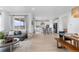 Open-concept living area with kitchen, dining, and living spaces filled with natural light at 13446 Amber Sky St, Parker, CO 80134