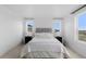Bright main bedroom with large windows, carpet floors, and a neutral color palette at 13446 Amber Sky St, Parker, CO 80134