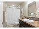 Clean bathroom featuring a shower, vanity with sink, and tile accents for a modern design at 1095 W 69Th Ave, Denver, CO 80221