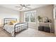 A bedroom with carpet, a bed, a window, and a table at 1095 W 69Th Ave, Denver, CO 80221