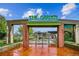 Attractive brick entrance to 'The Garden' with an inviting pathway and landscaped surroundings at 1095 W 69Th Ave, Denver, CO 80221