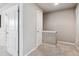 Neutral hallway featuring white doors and trim plus wall-to-wall carpeted floors at 1095 W 69Th Ave, Denver, CO 80221