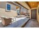 Inviting back patio featuring stamped concrete, a BBQ, and a charming outdoor spa at 519 S Gaylord St, Denver, CO 80209
