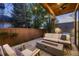 Inviting backyard patio featuring a comfortable seating area and a modern gas fire pit at 519 S Gaylord St, Denver, CO 80209