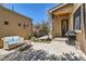 Outdoor patio area with BBQ grill, lounge seating, and flowering tree, perfect for relaxation at 519 S Gaylord St, Denver, CO 80209