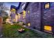 Backyard with manicured lawn and garden. A classic brick house and outdoor games included at 519 S Gaylord St, Denver, CO 80209